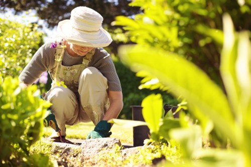 Gardener working in a suburban Ruislip front garden